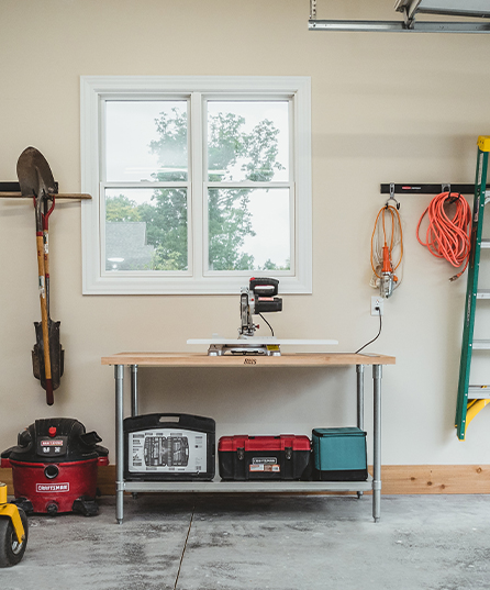 A garage with a table with a John Boos countertop