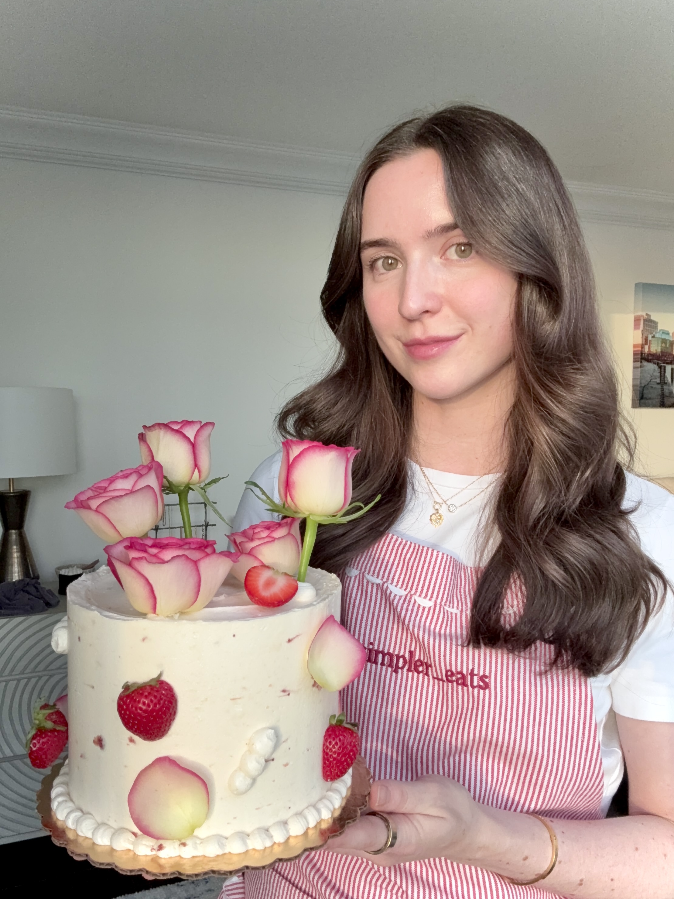 Gillian Simpler holding a homemade cake